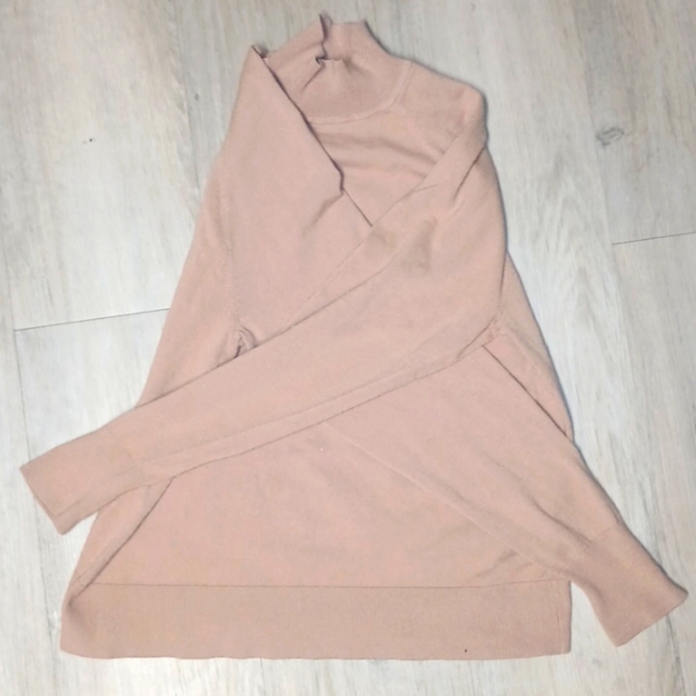 Women's turtle neck. Small hole in sleeve.